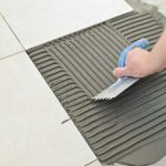 Tile repair in progress, ensuring the longevity of your home