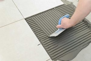 Tile repair in progress, ensuring the longevity of your home