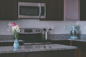 A polished granite countertop shining after thorough granite cleaning and sealing, showcasing its durability and elegance in a Colorado home